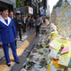 South Korean Gender Minister Kang Eun-hee looks at Post-it messages on the wall of a subway exit in Gangnam, Seoul, South Korea, 20 May 2016, which citizens left to mourn the brutal murder of a 23-year-old woman in an alleged hate crime.